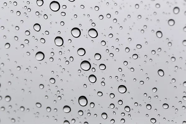 Wassertropfen für den Hintergrund auf Glas Autoscheibe zu abstrahieren — Stockfoto