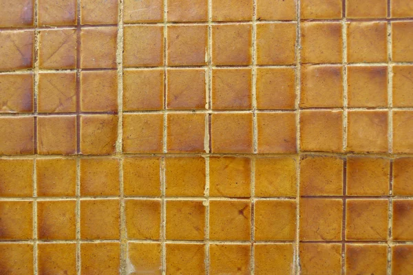 Azulejos antiguos de pared grunge naranja de la textura del edificio . — Foto de Stock