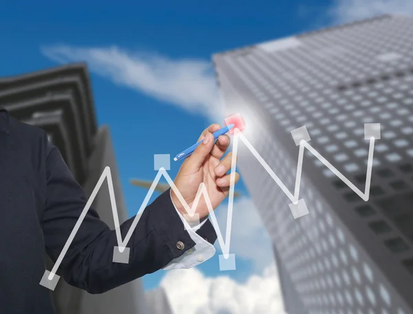 Hand of businessman drawing graphics a top point growing graph t — Stock Photo, Image