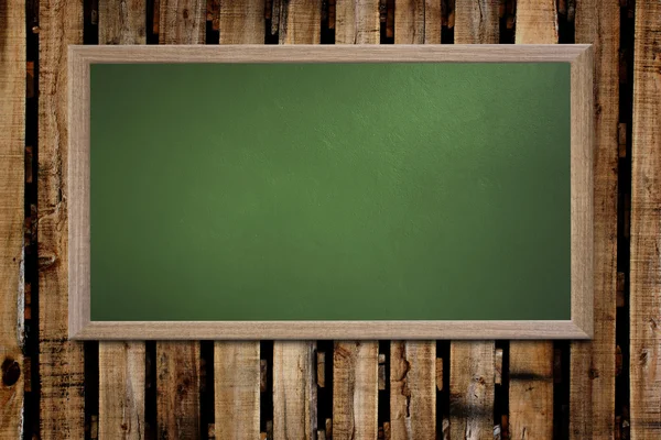 Blank old school blackboard on a grunge wall and can input text — Stockfoto