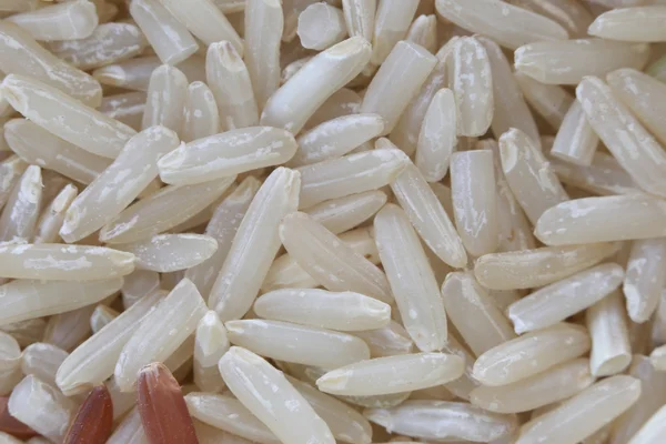 Bio barna rizs, a természet élelmiszer háttér halom. — Stock Fotó
