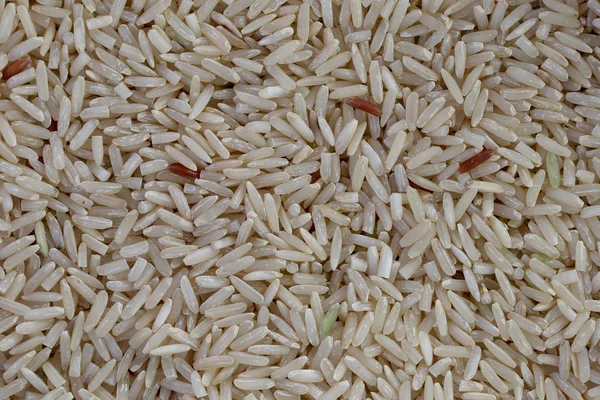 Pile of organic brown rice for the nature food background. — Stock Photo, Image