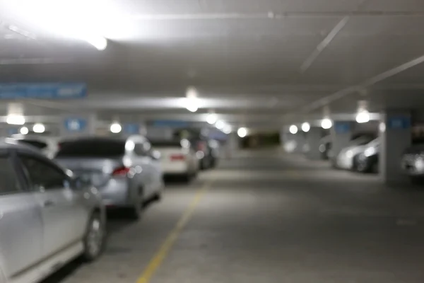 Parking in a blur at night and lighting. — Stock Photo, Image