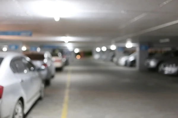 Parking in a blur at night and lighting. — Stock Photo, Image