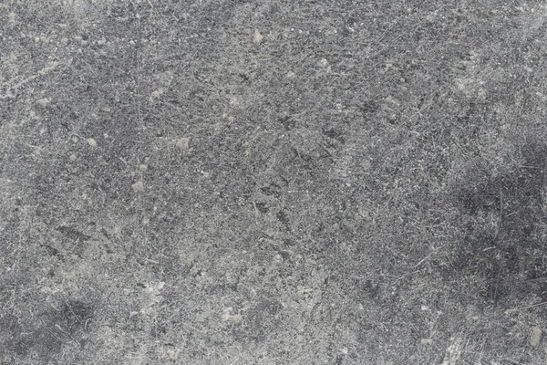 Oberfläche aus verschmutztem Steinboden im verwitterten Außenbereich. — Stockfoto