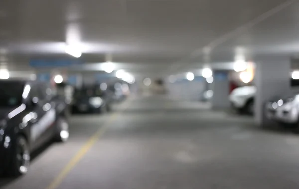 Parking in a blur at night and lighting. — Stock Photo, Image