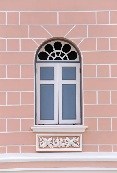 Vintage window on a polished stone wall. — Stock Photo, Image