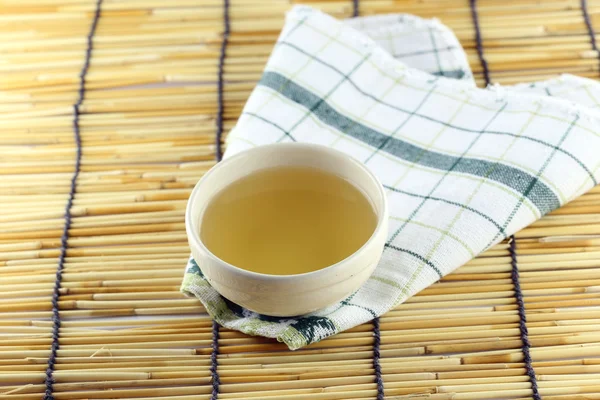 Japanese tea on a bamboo background. — Stock Photo, Image