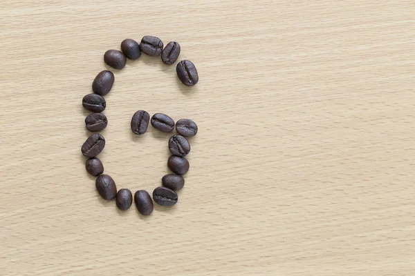 Coffee beans of alphabet. — Stock Photo, Image