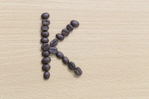 Coffee beans of alphabet. — Stock Photo, Image