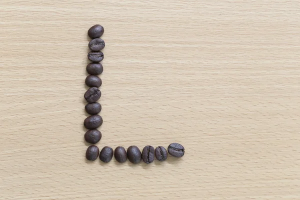 Coffee beans of alphabet. — Stock Photo, Image