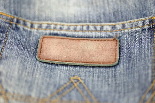 Die Rückseite der Jeans beschriften. — Stockfoto
