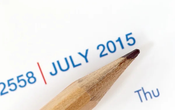 The tip of a pencil point to the year 2015 blur Text. — Stock Photo, Image
