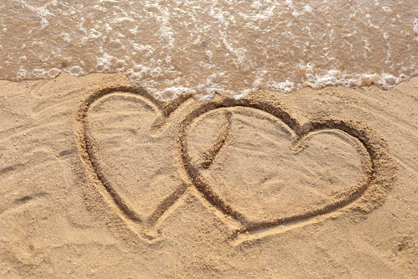 Beaches waves and heart shape drawn. — Stock Photo, Image