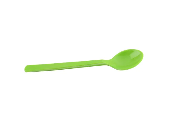 Green plastic spoon isolated on white. — Stock Photo, Image