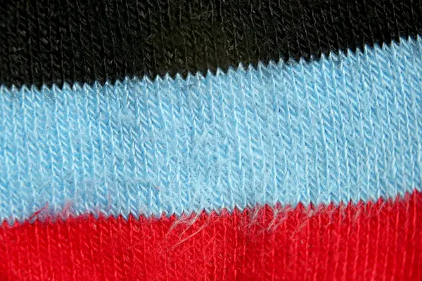 Επιφάνεια του πολύχρωμο ύφασμα κάλτσες σε μακροεντολή στυλ. — Φωτογραφία Αρχείου