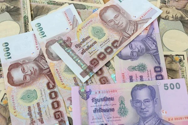 Bankovky peněz, Japonsku a Thajsku. — Stock fotografie