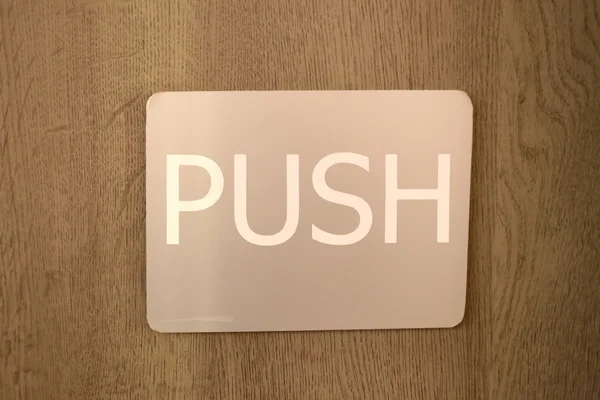 Známky zobrazující dveře s push. — Stock fotografie