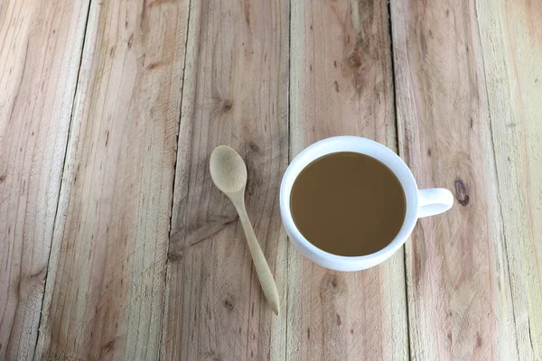 White coffee cup and wooden spoon. — Stock Photo, Image