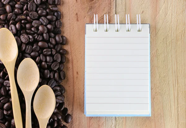 Coffee bean and notebook. — Stock Photo, Image