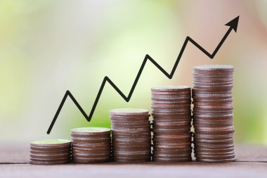 silver coin stack and arrow line in business growth concept on w