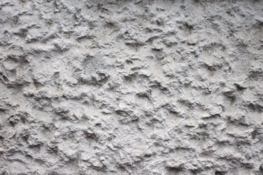 Çimento duvardaki pürüzlü yüzeye.