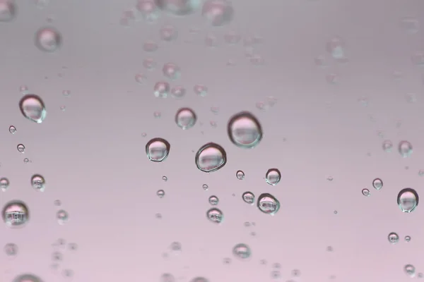 Gotas de lluvia sobre fondo de vidrio. — Foto de Stock