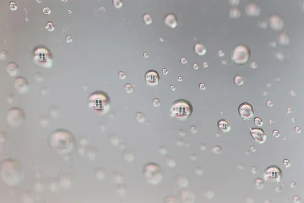 Regen druppels op glas achtergrond. — Stockfoto