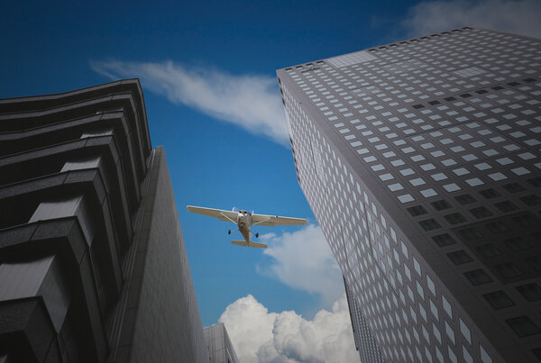 Skyscrapers and airplanes on sky for business concept.