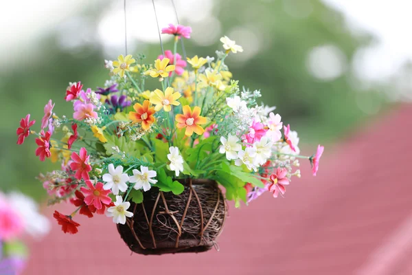 Artificial colorful flowers in pot. — Stock Photo, Image