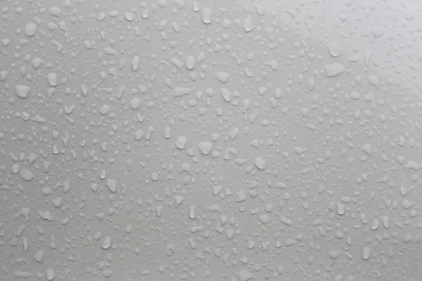 Krople deszczu na szklanym tle. — Zdjęcie stockowe