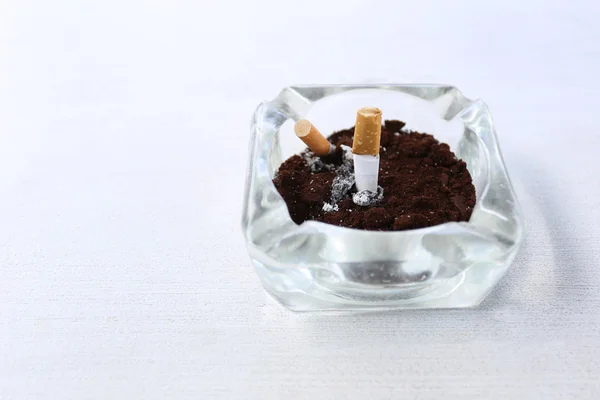 Ashtray on the white table. — Stock Photo, Image