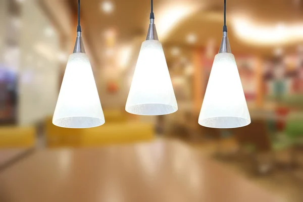 Warm lighting modern ceiling lamps in the cafe. — Stock Photo, Image