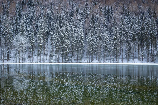 Frozen winter lake in the mountains