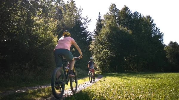 Two females riding mtb bikes