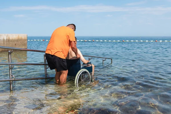 Wheelchair ramp for entering the seawater