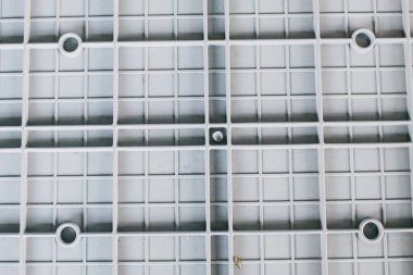 Duvar kağıdı ve arkaplan için gri plastik kutunun yakın plan fotoğrafı.