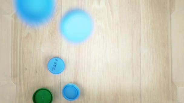 Green Blue Caps Lids Drop Box Used Plastic Bottles Concept — Stock Video