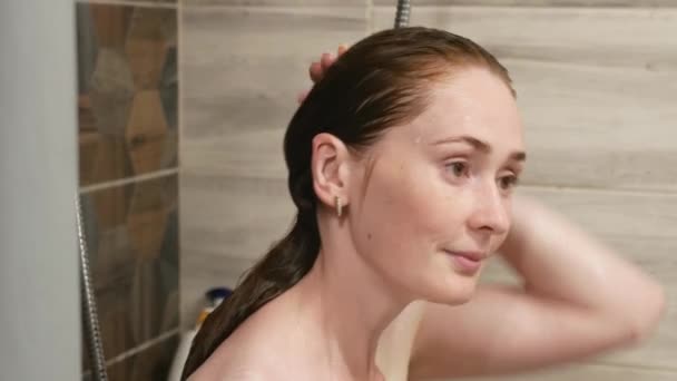 Young Woman Washes Hair Bathroom Beautiful Red Hair Woman Wets — Stock Video