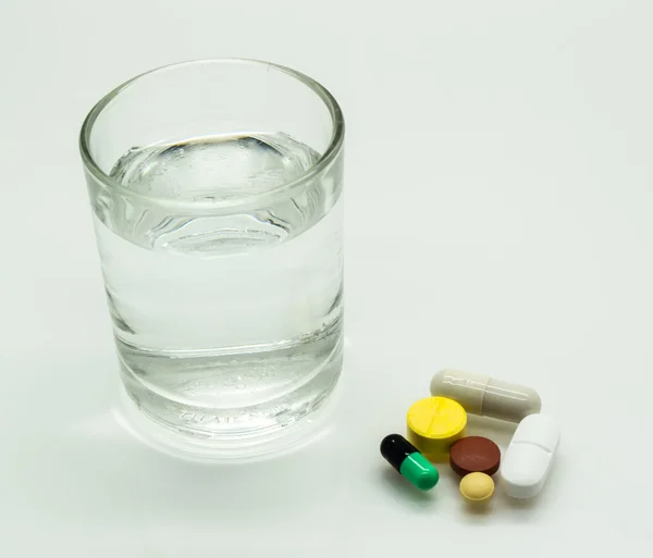 Medicine, capsule, Pill and glass of water — Stock Photo, Image