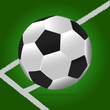 Futbol topu yeşil arka plana sahip