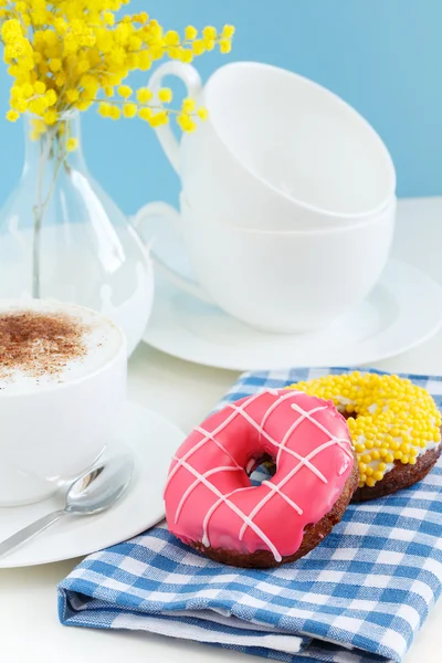 Breakfast with donuts and cappuccin — Stock Photo, Image