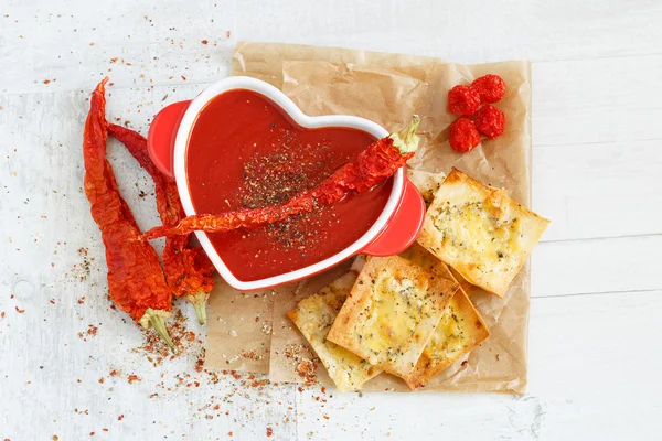 Top view of a spicy tomato soup with chips — Stock Image Top view of a spicy tomato soup with chips Stock Photo