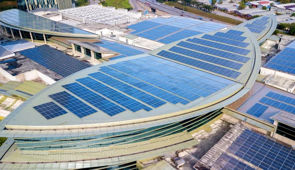 Solar panel on top of high commercial building. Solar Panel uses photo-voltaic cells use sunlight as a source of energy and generate direct current electricity