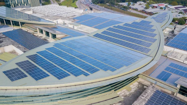 Solar panel on top of high commercial building. Solar Panel uses photo-voltaic cells use sunlight as a source of energy and generate direct current electricity