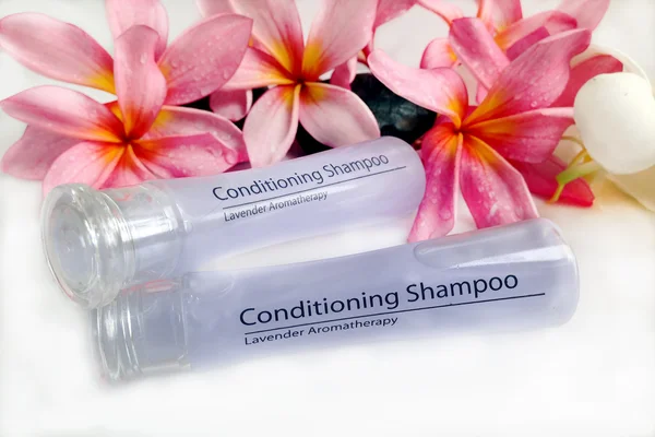 Toiletries with plumeria flower Royalty Free Stock Images