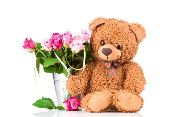 Teddy bear and flowers in the vase — Stock Photo, Image