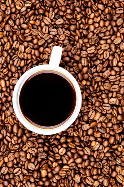 Cup of coffee on beans background — Stock Photo, Image