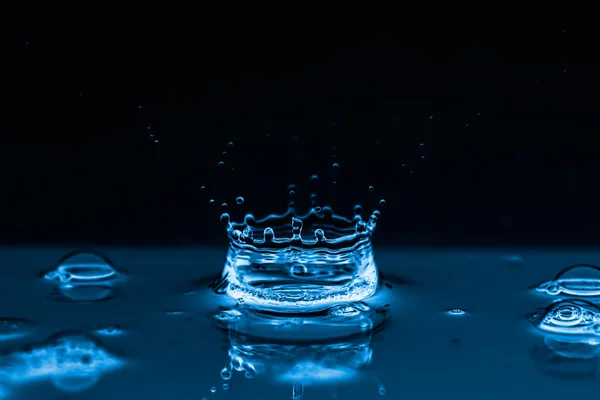 Water splash on black — Stock Photo, Image