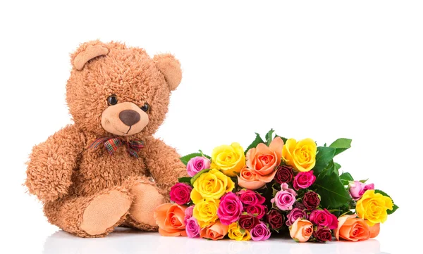 Rosas y oso de peluche — Foto de Stock